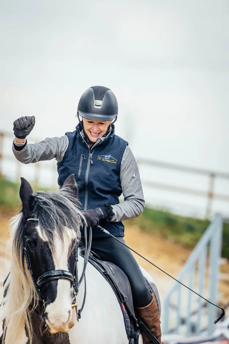 A dressage rider riding a dressage horse in a dressage coaching session